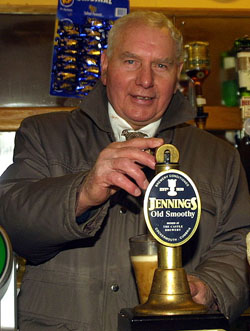 JJ pulls a pint to open the bar named in his honour in 2002
