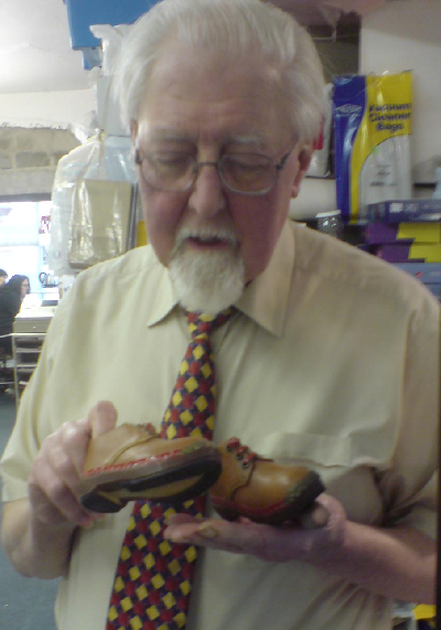 John Mason with miniature clogs